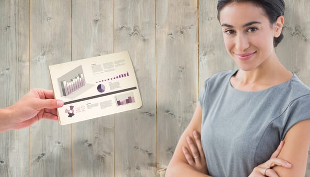 Smiling businesswoman against pale wooden planks