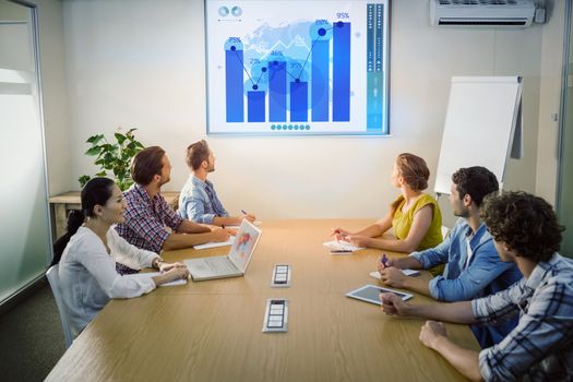 Business interface  against attentive business team following a presentation