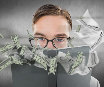 Geeky man looking over book against white and grey background