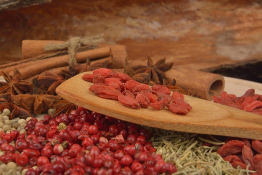 different spices on wooden background. close up