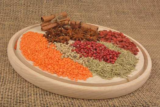 different spices on wooden background. 