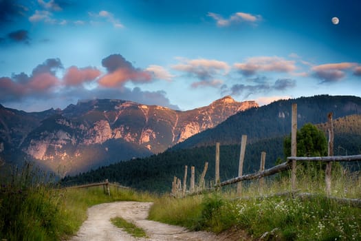 Evening, sunset on mountain hills of Simon village. Bran.