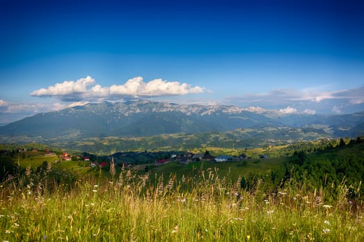 Evening, sunset on mountain hills of Simon village. Bran.