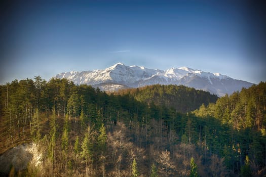 Morning mountain landscape. Dramatic sky. Light and colors effects