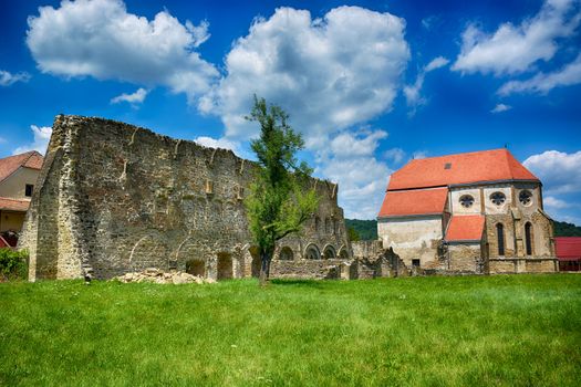 Cârţa Monastery is a former Cistercian (Benedictine) monastery in the Ţara Făgăraşului region in southern Transylvania. The monastery was probably founded in 1202-1206 by monks from Igriș abbey (daughter house of Pontigny abbey)