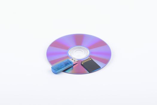 Flash card lying on a disk on a dark grey background