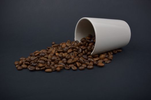 coffee beans stripes and cup in dark background