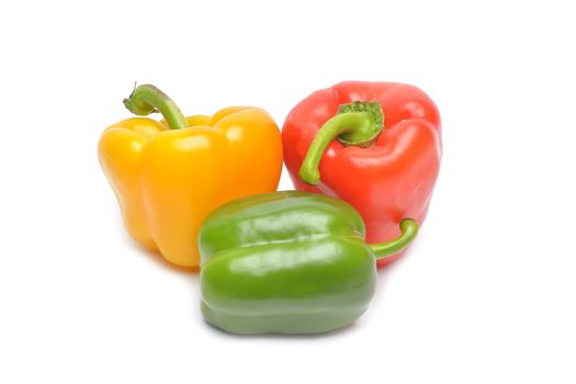 Colored peppers on white background