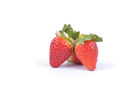 Strawberries with leaves. Isolated on a white background.