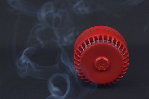 red fire siren with smoke 