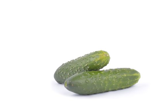 green cucumbers on white background