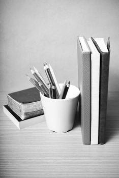 book and color pencil on wood background black and white color tone style