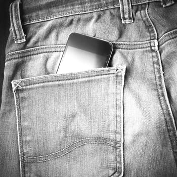 smart phone in jean pocket pants black and white tone color style