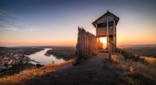 Wooden Tourist Observation Tower above a Little City of Hainburg an der Donau with Danube River at Beautiful Sunset