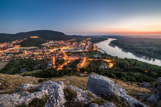 View of Lit Small City of Hainburg an der Donau with Danube River as Seen from Braunsberg Hill at Beautiful Sunset