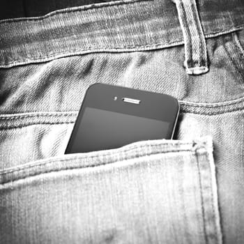 smart phone in jean pocket pants black and white tone color style