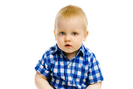 baby boy sitting on a white background