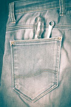 screwdriver in jean pocket pants retro vintage style