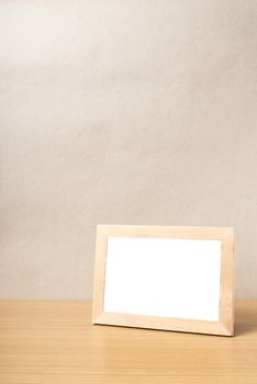 picture frame on wood table background