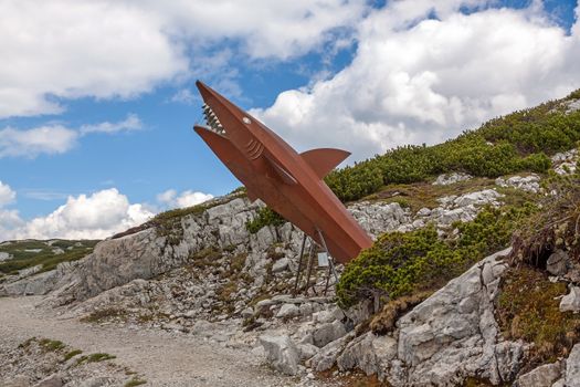 Obertraun, Austria - June 27, 2014: Dachstein Shark, attraction on the Heilbronn circular trail. It provides visitors with a glimpse into the pre-historic past of the Dachstein Massif.