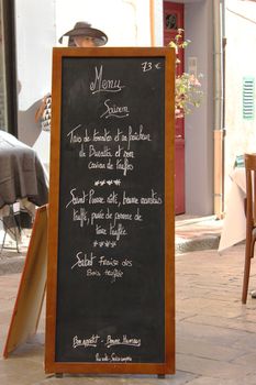 Front of Restaurant with Expensive Blackboard Menu in Saint-Tropez, France