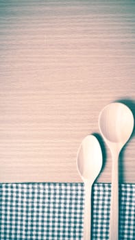 wood spoon and kitchen towel on table vintage style