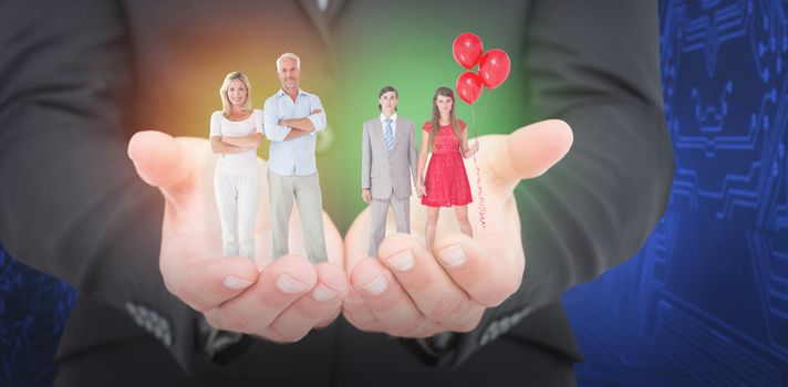 Unsmiling geeky couple standing hand in hand against shiny silhouette on blue background