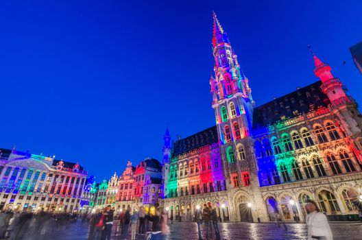 Brussels, Belgium - May 13, 2015: Tourists visiting famous Grand Place (Grote Markt) the central square of Brussels. The square is the most important tourist destination and most memorable landmark in Brussels.