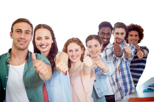 Fashion students showing thumbs up against white background with vignette