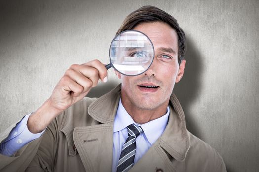 Spy looking through magnifier against white and grey background