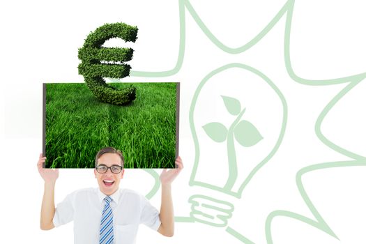 Man holding lawn book against euro sign made of leaves