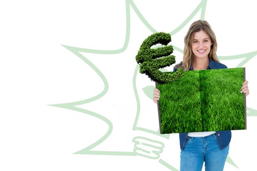 Woman holding lawn book against euro sign made of leaves