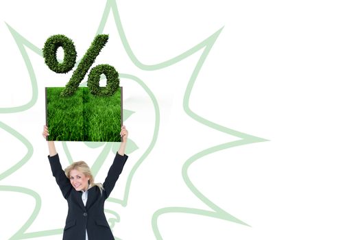 Woman holding up lawn book against percentage sign made of leaves