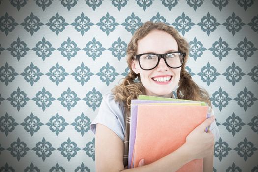 Geeky hipster woman holding files  against blue background