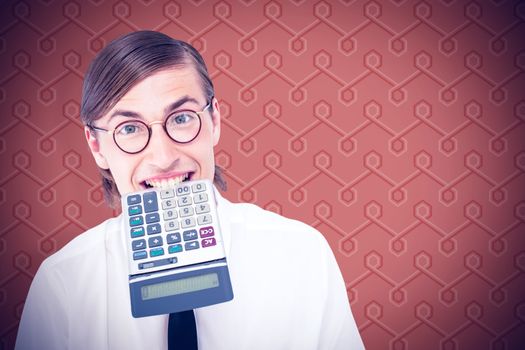 Geeky smiling businessman biting calculator  against background