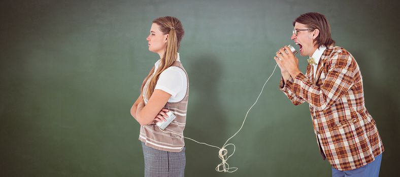 Geeky hipsters using string phone  against green chalkboard