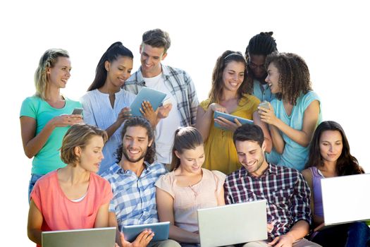 Several students using electronic devices against white background with vignette