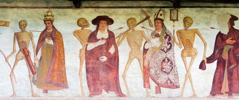 Detail of fresco La danza macabra (Macabre dance), Simone Baschenis 1539. Ancient church of San Vigilio (1515) in Pinzolo, Trento Italy