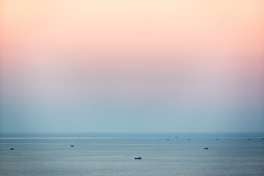 Small fishing boats in South China Sea at dusk, Mui Ne, Vietnam