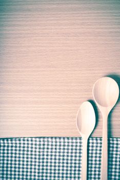 wood spoon and kitchen towel on table vintage style