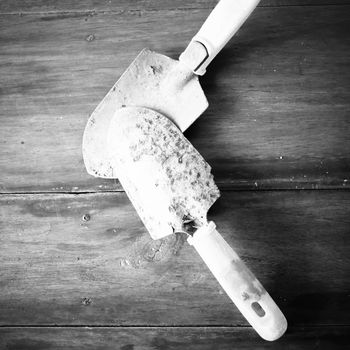 shovel on wood background black and white color tone style