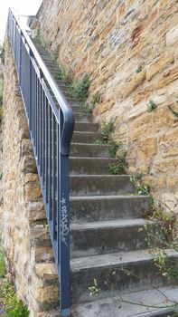 Long outdoor concrete stairs in the city of Lyon in France