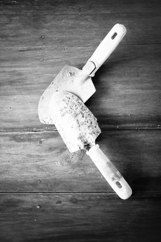 shovel on wood background black and white color tone style