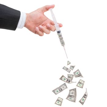 hand holding syringe filled with currency on white background