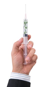 hand holding syringe filled with currency on white background