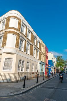 LONDON - JUNE 14, 2015: Buildings of Portobello Road in Notting Hill. London is visited by 50 million people annually.