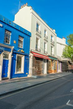 LONDON - JUNE 14, 2015: Buildings of Portobello Road in Notting Hill. London is visited by 50 million people annually.