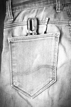 screwdriver in jean pocket pants black and white tone color style