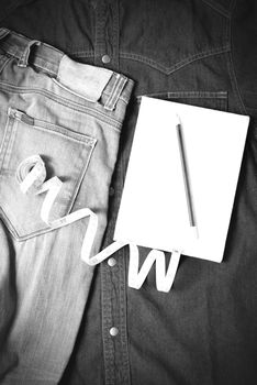 measuring tape and notebook with jean black and white tone color style