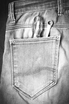 screwdriver in jean pocket pants black and white tone color style